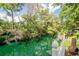 Scenic view of the waterway with lush trees as seen from the wood deck of this home at 174 Edward Ave., Murrells Inlet, SC 29576