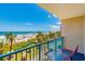 Balcony view showcasing the beach with colorful umbrellas, palm trees, and blue sky at 201 74Th Ave. N # 2333, Myrtle Beach, SC 29572
