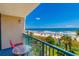 Balcony view showcasing the beach with colorful umbrellas and palm trees at 201 74Th Ave. N # 2333, Myrtle Beach, SC 29572