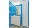 Modern bathroom featuring blue subway tile, a floating vanity, and a mirrored medicine cabinet at 201 74Th Ave. N # 2333, Myrtle Beach, SC 29572