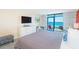 Bedroom with a comfortable bed, TV, chest of drawers, desk, and ocean view at 201 74Th Ave. N # 2333, Myrtle Beach, SC 29572