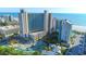 Stunning aerial view of a beachfront resort with pools, water park, and ocean backdrop at 201 74Th Ave. N # 2740, Myrtle Beach, SC 29572