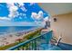 Relaxing balcony view of the ocean and sandy beach with umbrellas and clear blue water, and outdoor furniture at 201 74Th Ave. N # 2740, Myrtle Beach, SC 29572