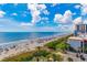 Breathtaking ocean view from balcony, overlooking the beach with crystal blue water and vacationers at 201 74Th Ave. N # 2740, Myrtle Beach, SC 29572
