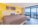 Bright bedroom with a large bed and a balcony overlooking the ocean at 201 74Th Ave. N # 2740, Myrtle Beach, SC 29572