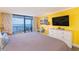 Inviting bedroom featuring a TV, dresser and sliding glass doors with ocean views at 201 74Th Ave. N # 2740, Myrtle Beach, SC 29572