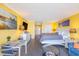 Bright condo interior with contemporary decor, a queen-size bed and a seating area with modern furniture at 201 74Th Ave. N # 2740, Myrtle Beach, SC 29572