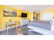 Well-lit condo interior featuring a queen-size bed, a seating area, and contemporary decor at 201 74Th Ave. N # 2740, Myrtle Beach, SC 29572