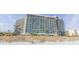 Stunning exterior view of a modern high-rise condo building with ocean views and beach access at 201 74Th Ave. N # 2740, Myrtle Beach, SC 29572