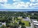 Expansive aerial view featuring a home in a tree-filled community, showcasing a waterfront vista and serene landscape at 2021 Loblolly St., Georgetown, SC 29440