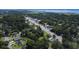Aerial shot of a home near a bustling street, surrounded by mature trees in a vibrant community at 2021 Loblolly St., Georgetown, SC 29440