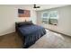 Bedroom with natural light from the window, ceiling fan, and an American flag decoration at 2021 Loblolly St., Georgetown, SC 29440