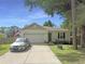 Charming single-story home with a well-maintained lawn, a two-car garage, and ample parking space at 2021 Loblolly St., Georgetown, SC 29440