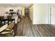 Open-concept living area with wood floors connecting the kitchen and other living spaces in the home at 2021 Loblolly St., Georgetown, SC 29440