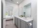 Modern bathroom with double sinks and a view to bedroom at 204 Kinross Ct., Little River, SC 29566