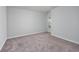 Empty room showing neutral carpeting and paint, ready for staging or personalization at 204 Kinross Ct., Little River, SC 29566