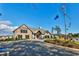 Exterior of the community clubhouse with stone facade and well-maintained landscaping at 204 Kinross Ct., Little River, SC 29566