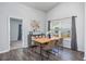 Dining area with modern table and chairs, natural lighting, and a stylish design at 204 Kinross Ct., Little River, SC 29566