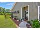 Charming entrance with a decorative wreath, lovely landscaping, and a welcoming vibe at 204 Kinross Ct., Little River, SC 29566