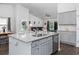 Open-concept kitchen with granite countertops, stainless steel appliances, and an island at 204 Kinross Ct., Little River, SC 29566