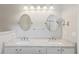 Bright bathroom featuring double vanity with granite countertops and brushed nickel fixtures at 2210 Haystack Way, Myrtle Beach, SC 29579