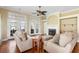 Cozy living room with hardwood floors, a fireplace, and French doors leading to outdoor space at 2210 Haystack Way, Myrtle Beach, SC 29579