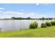 Scenic view of a peaceful pond surrounded by lush greenery and community homes at 2210 Haystack Way, Myrtle Beach, SC 29579