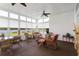 Inviting sun room with wicker furniture and views of the lake, perfect for relaxing and enjoying the scenery at 2210 Haystack Way, Myrtle Beach, SC 29579