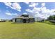 Expansive backyard featuring lush green grass, a screened-in porch and backyard fence at 2212 Leeboard Ct., Myrtle Beach, SC 29579