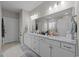 Bathroom featuring a double vanity with marble countertop and bright lighting at 2212 Leeboard Ct., Myrtle Beach, SC 29579