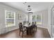 Dining room features a modern chandelier, large windows, and stylish decor at 2212 Leeboard Ct., Myrtle Beach, SC 29579