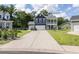 Charming two-story home boasts a welcoming porch, two-car garage, and long driveway at 2212 Leeboard Ct., Myrtle Beach, SC 29579