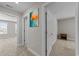 Hallway with neutral carpet, a painting on the wall, and doorways to adjacent rooms at 2212 Leeboard Ct., Myrtle Beach, SC 29579