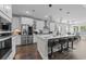 Modern kitchen with stainless steel appliances, an island with seating, and white cabinets at 2212 Leeboard Ct., Myrtle Beach, SC 29579
