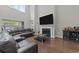 Living room features fireplace, hard wood floors, and a cozy sectional couch at 2212 Leeboard Ct., Myrtle Beach, SC 29579