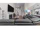 Cozy living room with a fireplace, large TV, and open to the kitchen at 2212 Leeboard Ct., Myrtle Beach, SC 29579