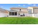 Spacious backyard features a screened porch and expansive lawn, creating an ideal space for outdoor activities and relaxation at 226 Calhoun Falls Dr., Myrtle Beach, SC 29579
