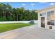 Spacious backyard with a white fence, concrete patio, and a storage shed at 226 Calhoun Falls Dr., Myrtle Beach, SC 29579