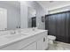 Bright bathroom featuring double sinks and a shower with a stylish striped curtain at 226 Calhoun Falls Dr., Myrtle Beach, SC 29579
