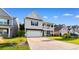 Charming two-story home with a white exterior, well-kept lawn, and a two-car garage at 226 Calhoun Falls Dr., Myrtle Beach, SC 29579
