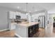 Modern kitchen with a large island, stainless steel appliances, and barstool seating for casual dining at 226 Calhoun Falls Dr., Myrtle Beach, SC 29579