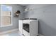 Modern laundry room with new appliances, a bright window, and shelves to organize laundry products at 226 Calhoun Falls Dr., Myrtle Beach, SC 29579