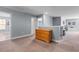 Spacious loft with neutral carpet, gray walls, natural light, and a wooden dresser for ample storage space at 226 Calhoun Falls Dr., Myrtle Beach, SC 29579