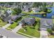 Aerial view of well-maintained home, lush lawn and garden, serene lake create an oasis at 2369 Clandon Dr., Myrtle Beach, SC 29579