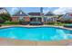 A sparkling pool reflects the home, offering a picturesque view and a refreshing escape in the backyard at 2369 Clandon Dr., Myrtle Beach, SC 29579