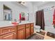 Bathroom featuring a shower/tub combo, dark wood vanity, and white countertop and walls at 2369 Clandon Dr., Myrtle Beach, SC 29579