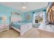 Comfortable bedroom with neutral walls, a ceiling fan, a bed with linens, and a window that lets in plenty of light at 2369 Clandon Dr., Myrtle Beach, SC 29579
