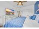 Bedroom featuring a white dresser with a TV, white walls, and a blue comforter at 2369 Clandon Dr., Myrtle Beach, SC 29579
