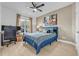 Bedroom featuring a bed with blue bedding, a ceiling fan, and a desk with a rolling office chair at 2369 Clandon Dr., Myrtle Beach, SC 29579