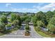 The entrance to Covington Lake features lush landscaping with mature trees and manicured flower beds at 2369 Clandon Dr., Myrtle Beach, SC 29579